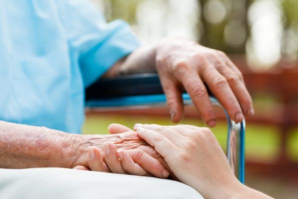 A young hand holding an older person's hand representing the services of MasterPeace Home Health Care in Mattapoisett, MA