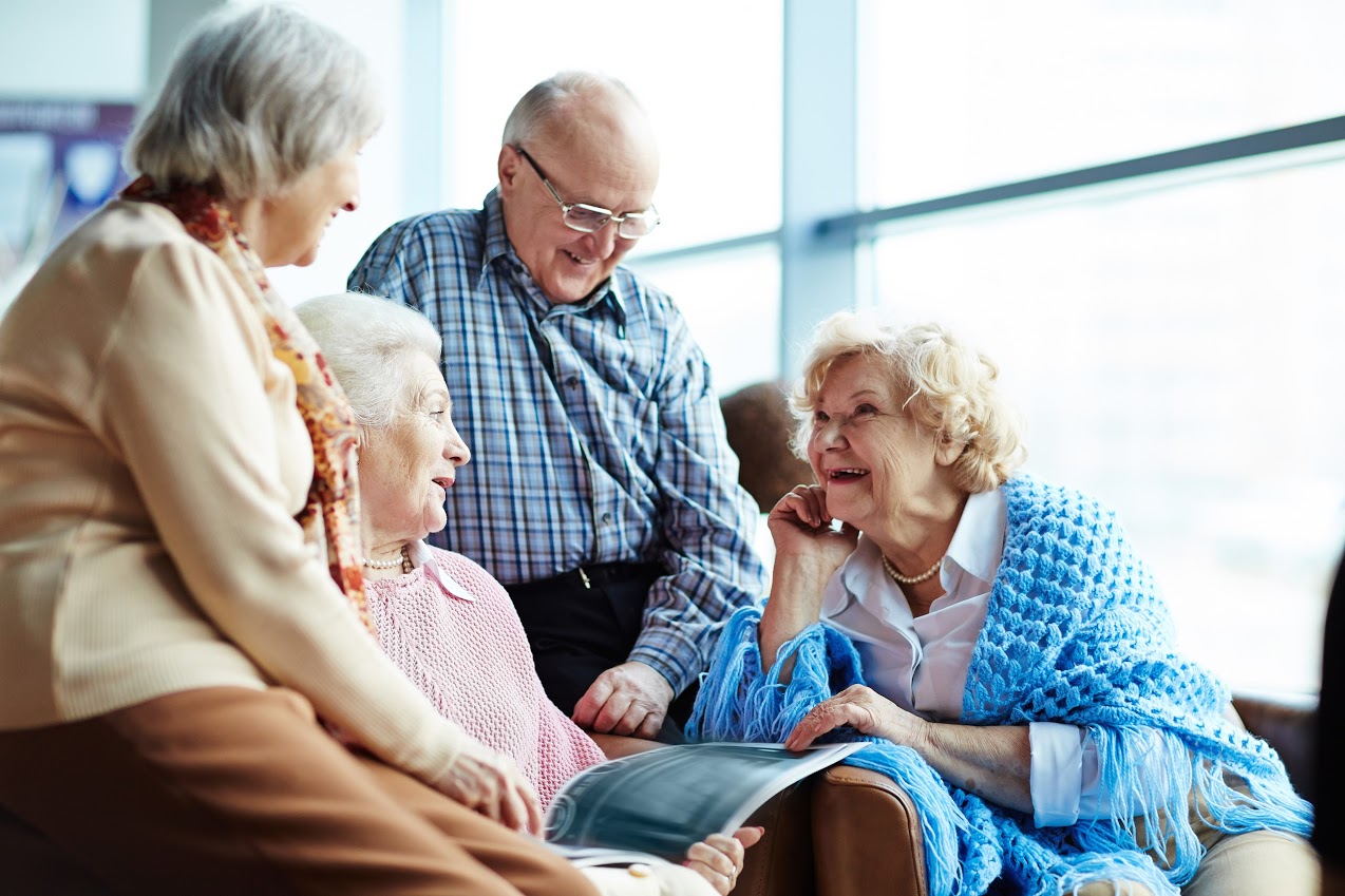 A group of elderly people talking